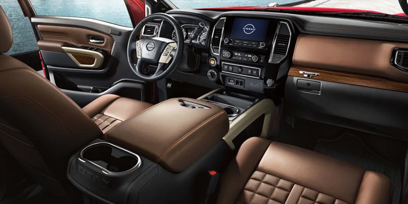 contrast stitching and ample legroom, emphasizing premium comfort